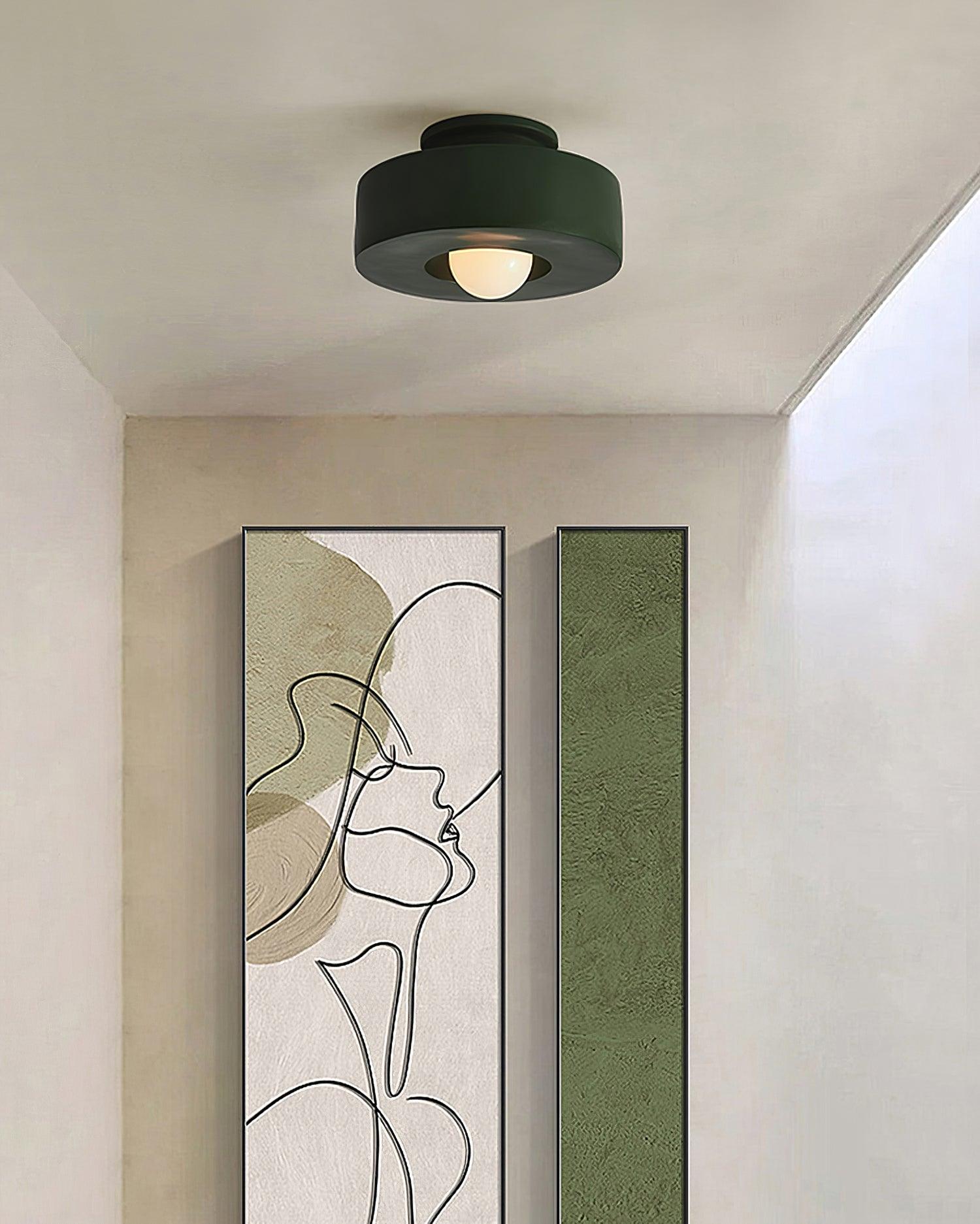 Stacked cylinder ceiling light detail in a soft neutral setting