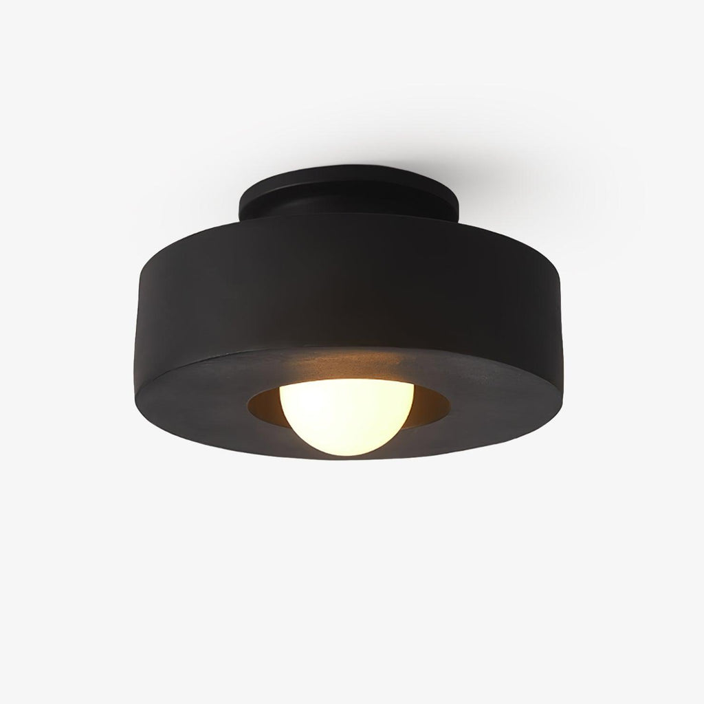 Ceiling light with descending resin cylinders against a pale ceiling