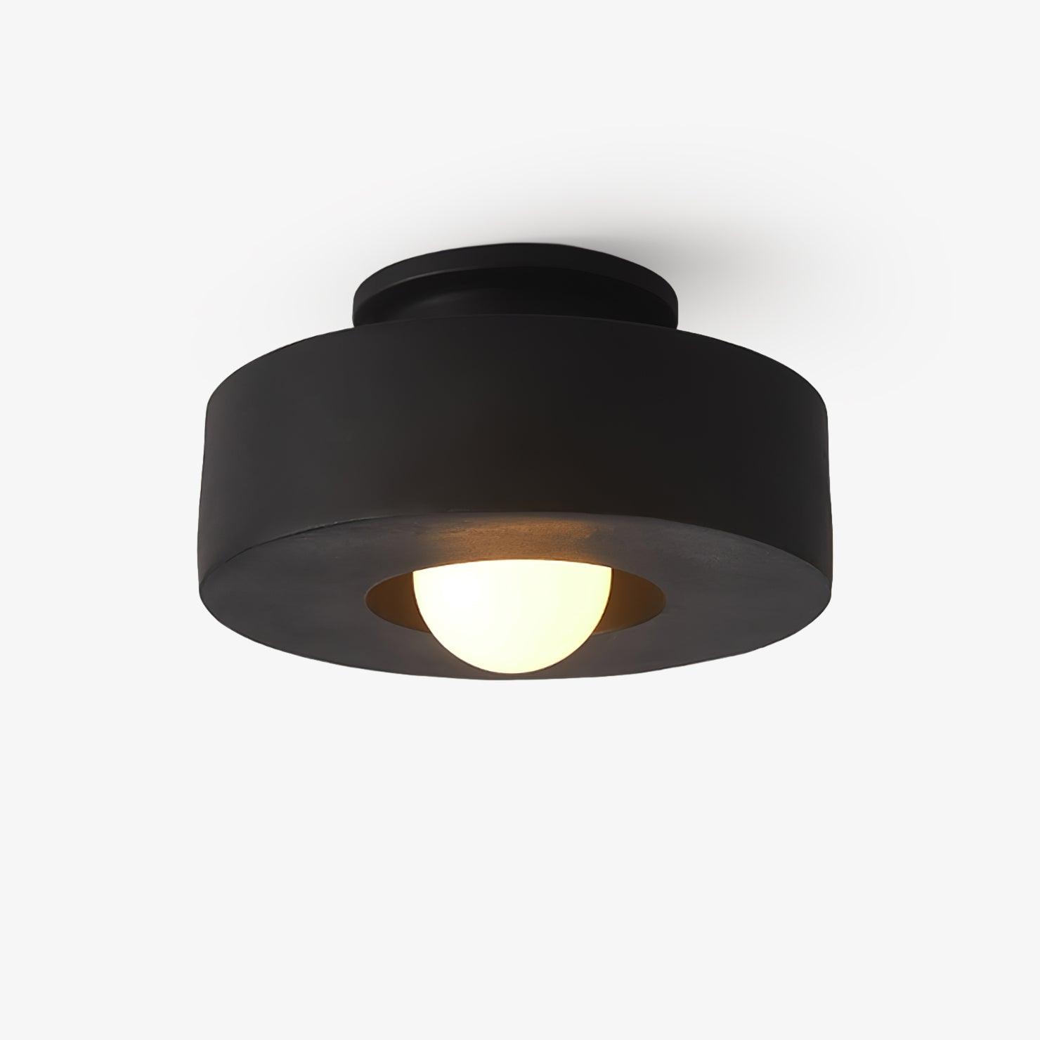 Ceiling light with descending resin cylinders against a pale ceiling