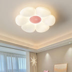 Flower ceiling light glowing above a dining table setting