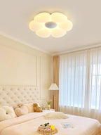Six-petal flower ceiling light styled in a bright bedroom