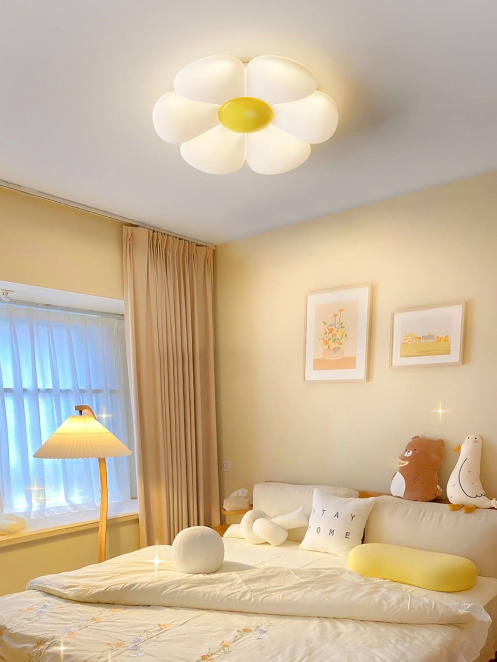 Petal ceiling light lit warmly above a small dining space