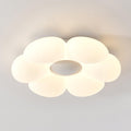 Six-petal flower ceiling light glowing softly above a styled room