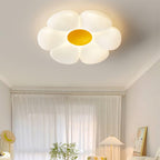 Petal-shaped ceiling light viewed at an angle while lit