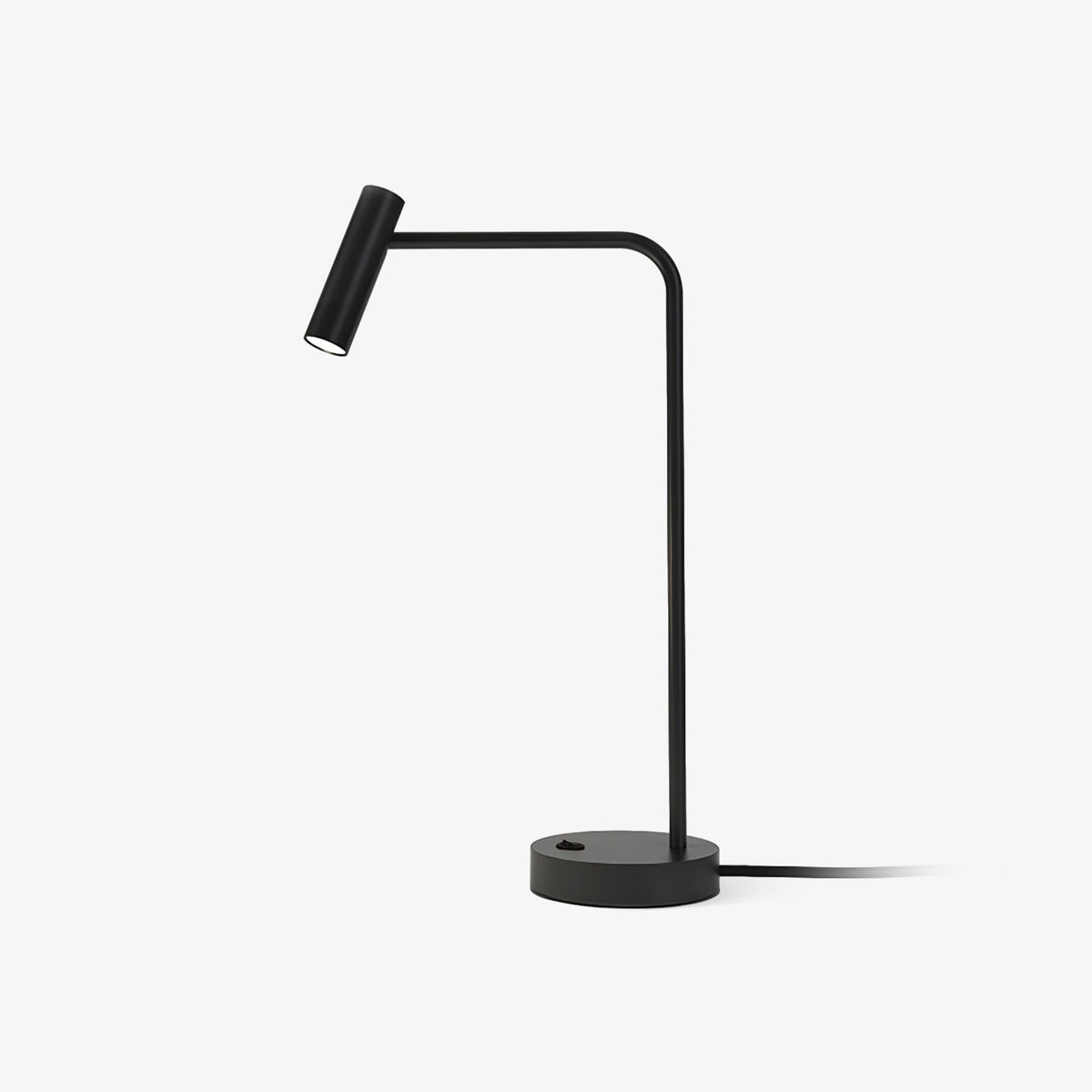 Studio shot of this black Clérachic table lamp, unlit, its cord curling from a round base.