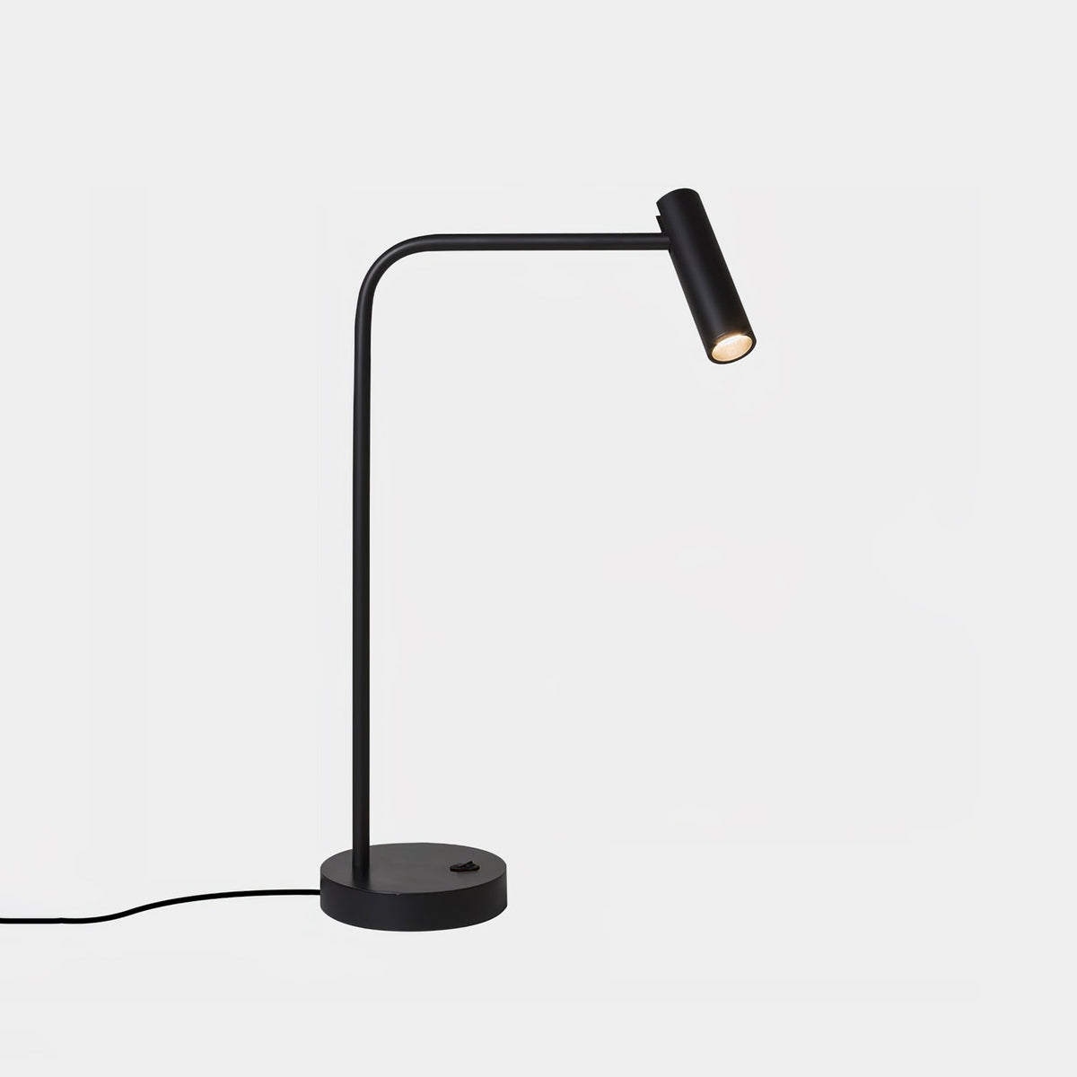 Angled studio shot of this black Clérachic table lamp, unlit, against a plain white backdrop.