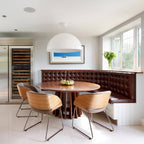 Hemisphere pendant light with smooth diffuser over a table