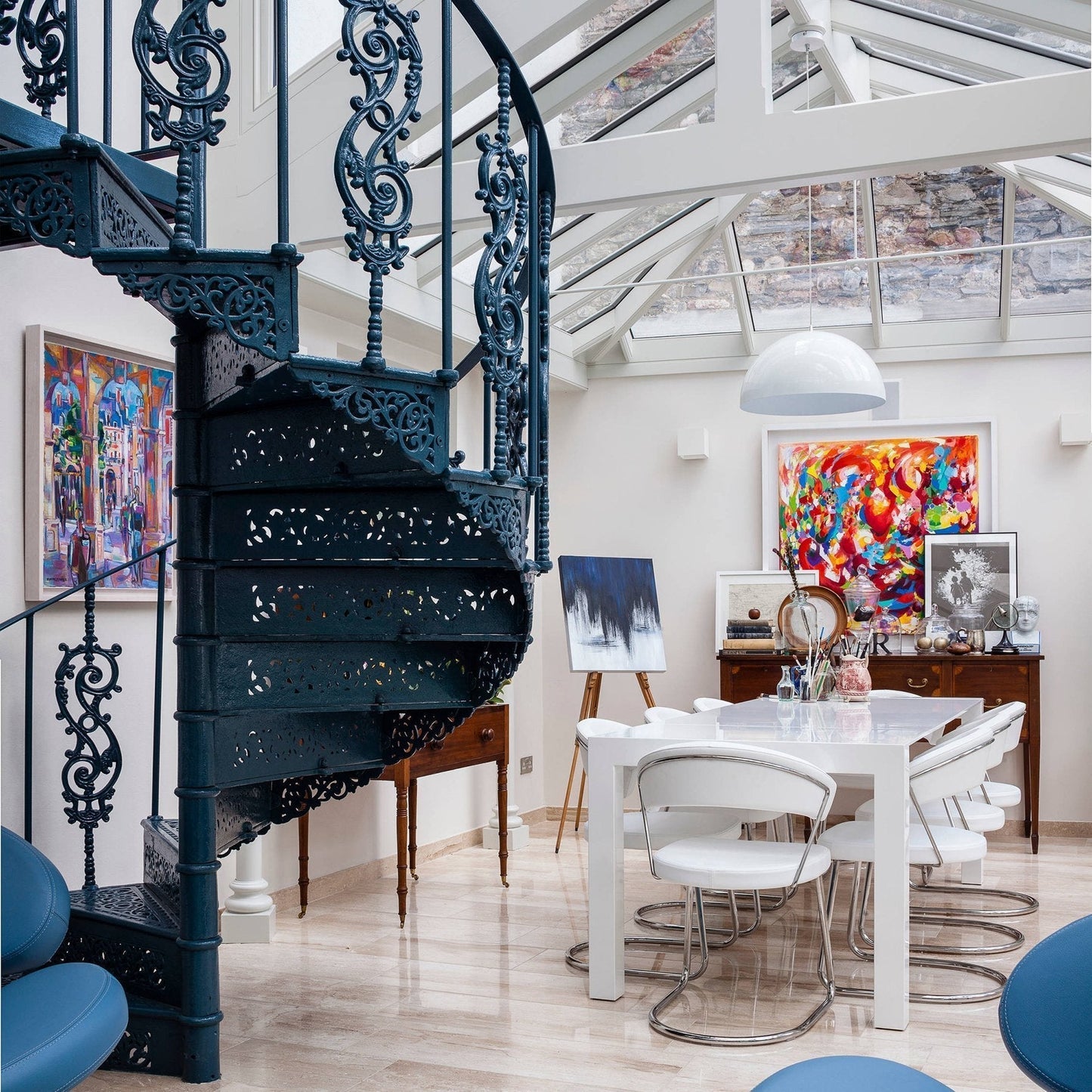 Hemisphere pendant light glowing over a long dining table