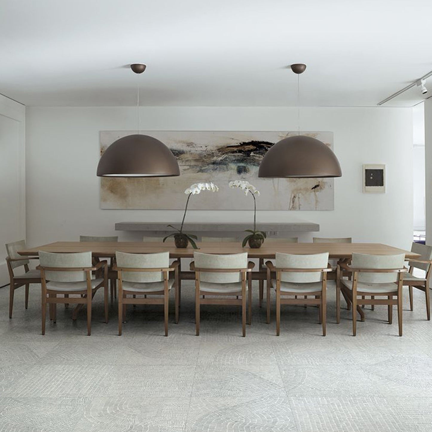 Cast plaster pendant casting even ambient light from above