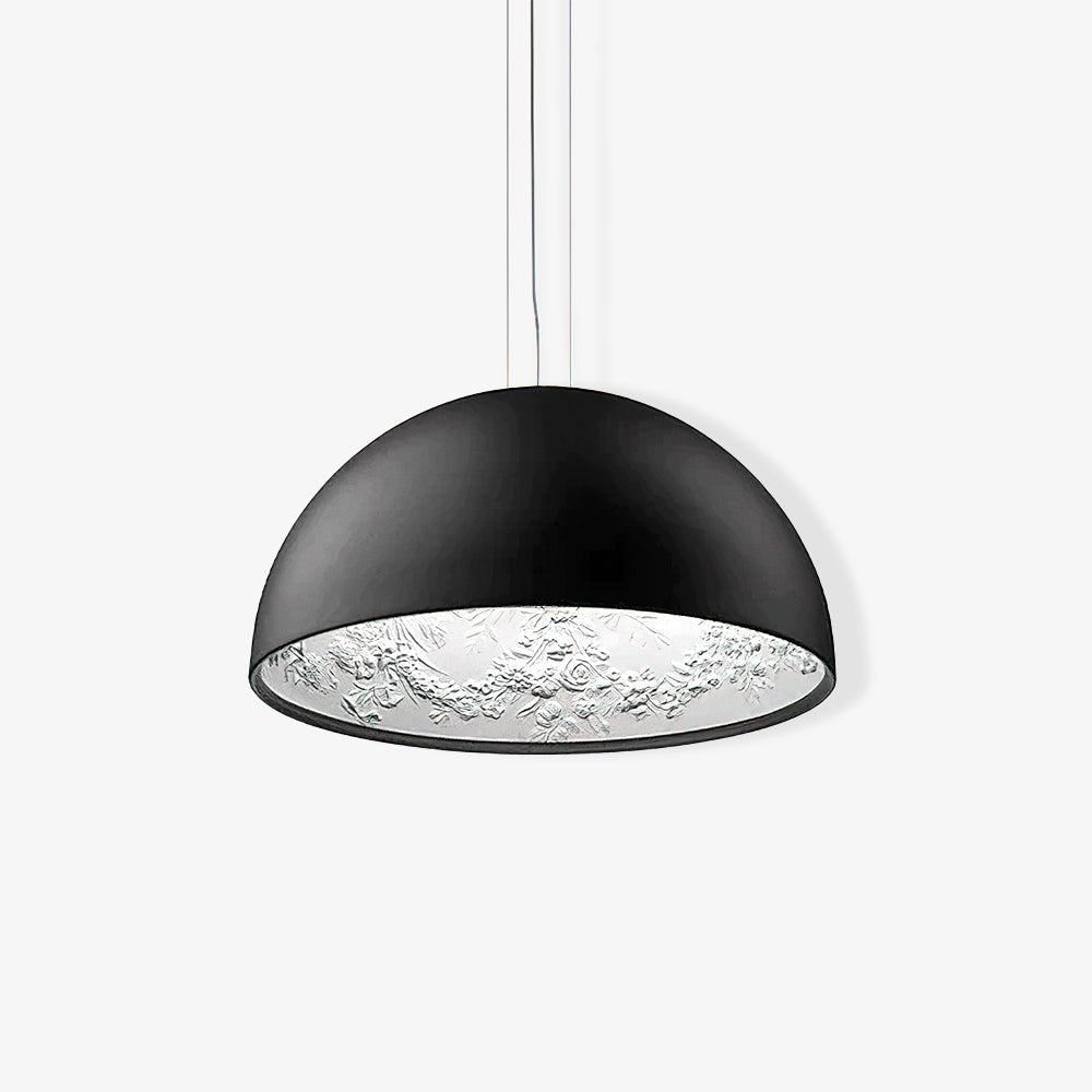 Hemisphere pendant light hanging low over a wood table