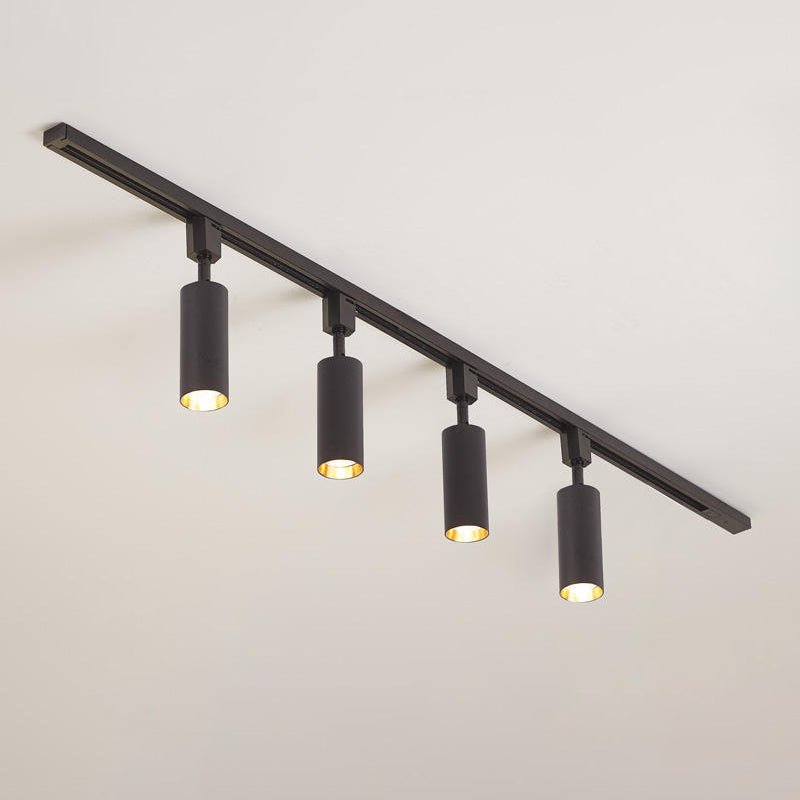 Slim cylinder spotlights on a track in a contemporary space