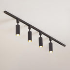 Slim cylinder spotlights on a track in a contemporary space