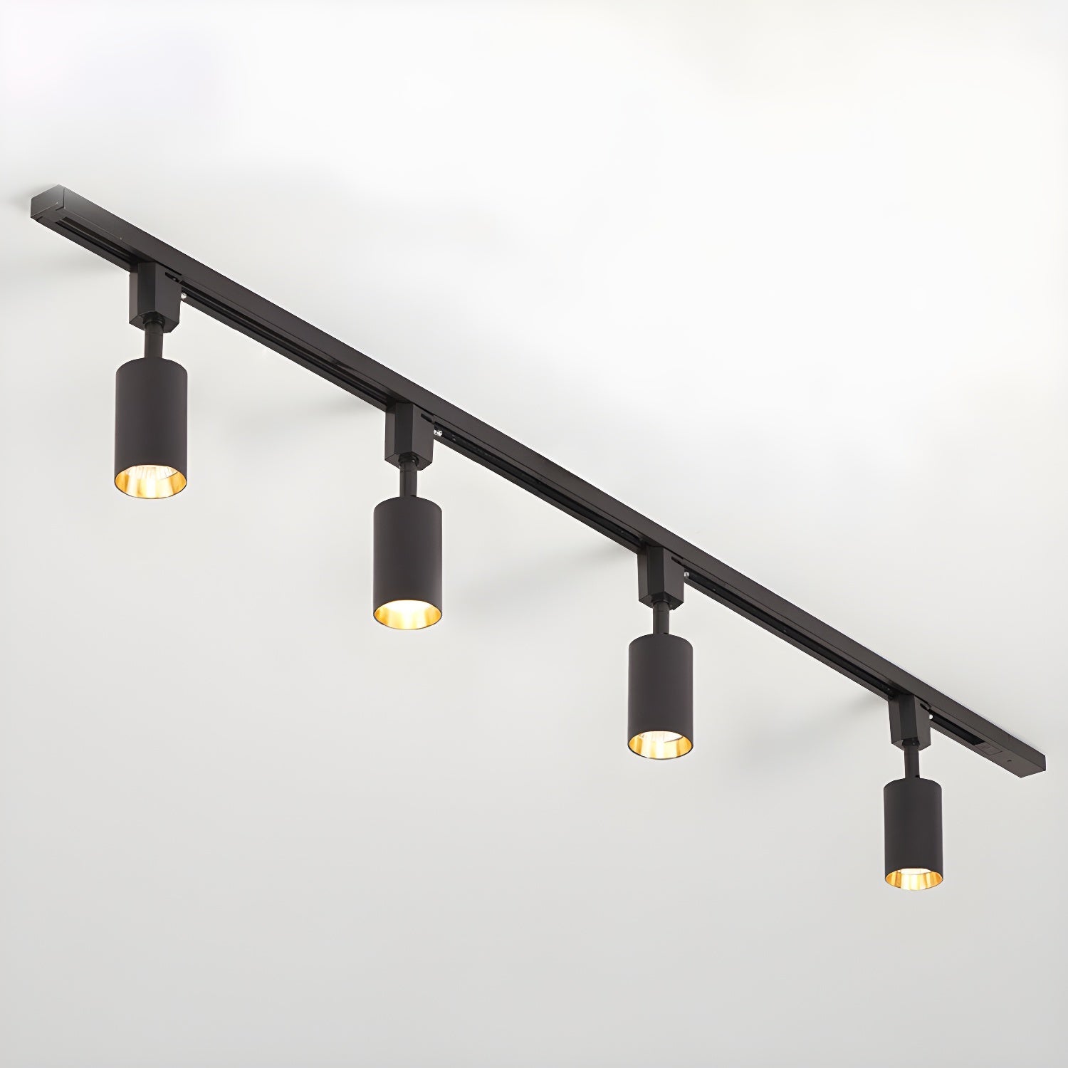 White track light heads angled to highlight a feature wall