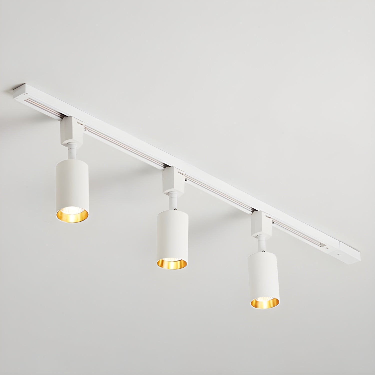 Cylinder track light with multiple heads in a minimal interior