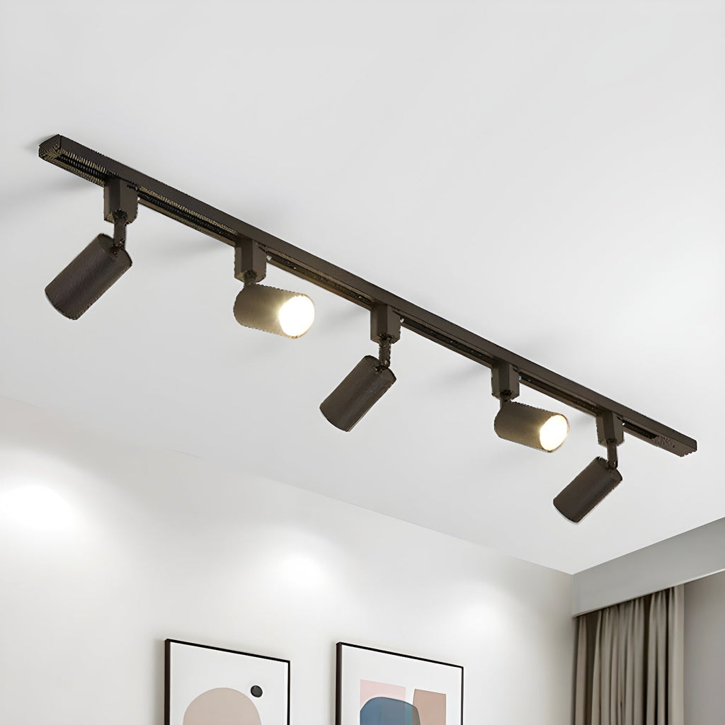 Track light with aluminium cylinder heads on a sleek rail
