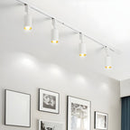 Cylinder track light spotlights lighting a modern hallway