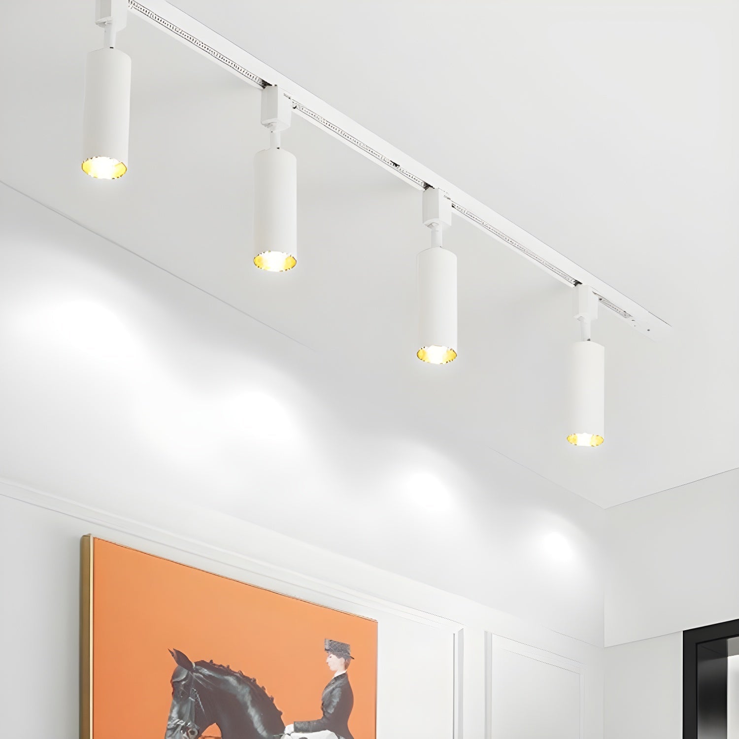 Cylinder track light spotlights shown in a bright interior