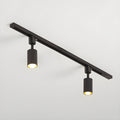 Cylinder track light with aluminium spotlights mounted on a ceiling