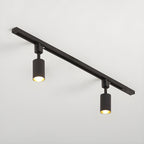 Cylinder track light with aluminium spotlights mounted on a ceiling