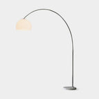 Clérachic arc floor lamp with a white dome shade shown full-length against a plain light background.