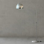 Clérachic arc floor lamp with a mirrored chrome dome shade shown full-length against a plain grey studio background.