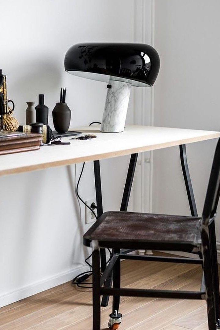 Marble table lamp with a glazed metal shade and warm light