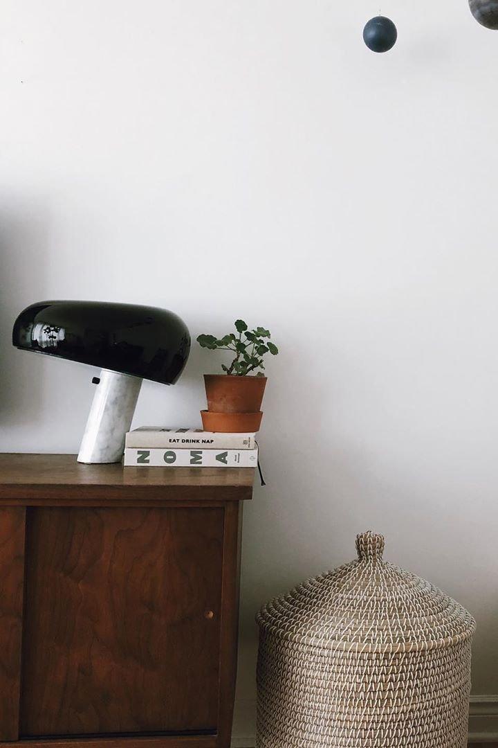 Marble base lamp with a glazed metal shade, lit