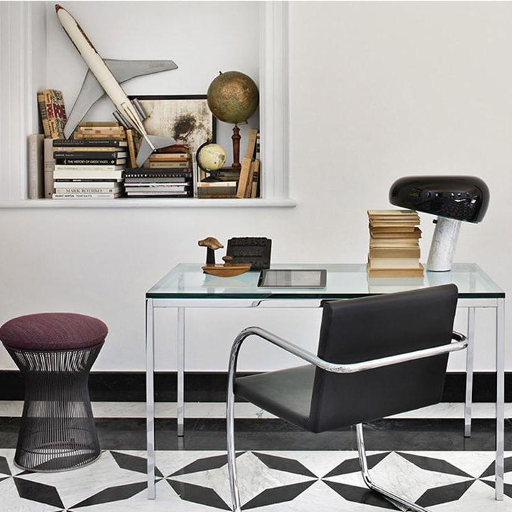 Marble base lamp with a glazed metal reflector, lit warm