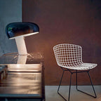 Marble table lamp with glazed metal shade and warm glow