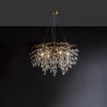 Round brass chandelier on dark grey, clear crystal petals falling in tiers below curved arms.