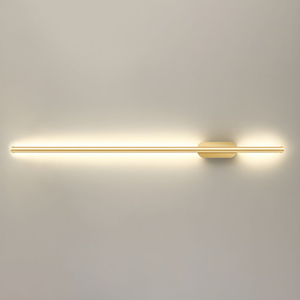 Gold linear LED sconce mounted in a refined hallway setting