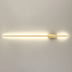 Gold linear LED sconce mounted in a refined hallway setting