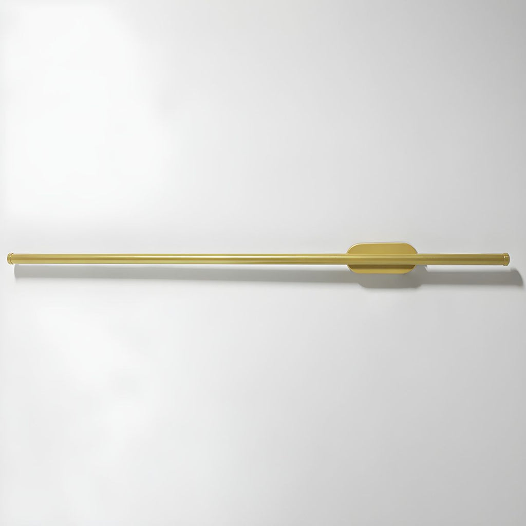 Linear LED wall sconce casting an even warm glow on plaster