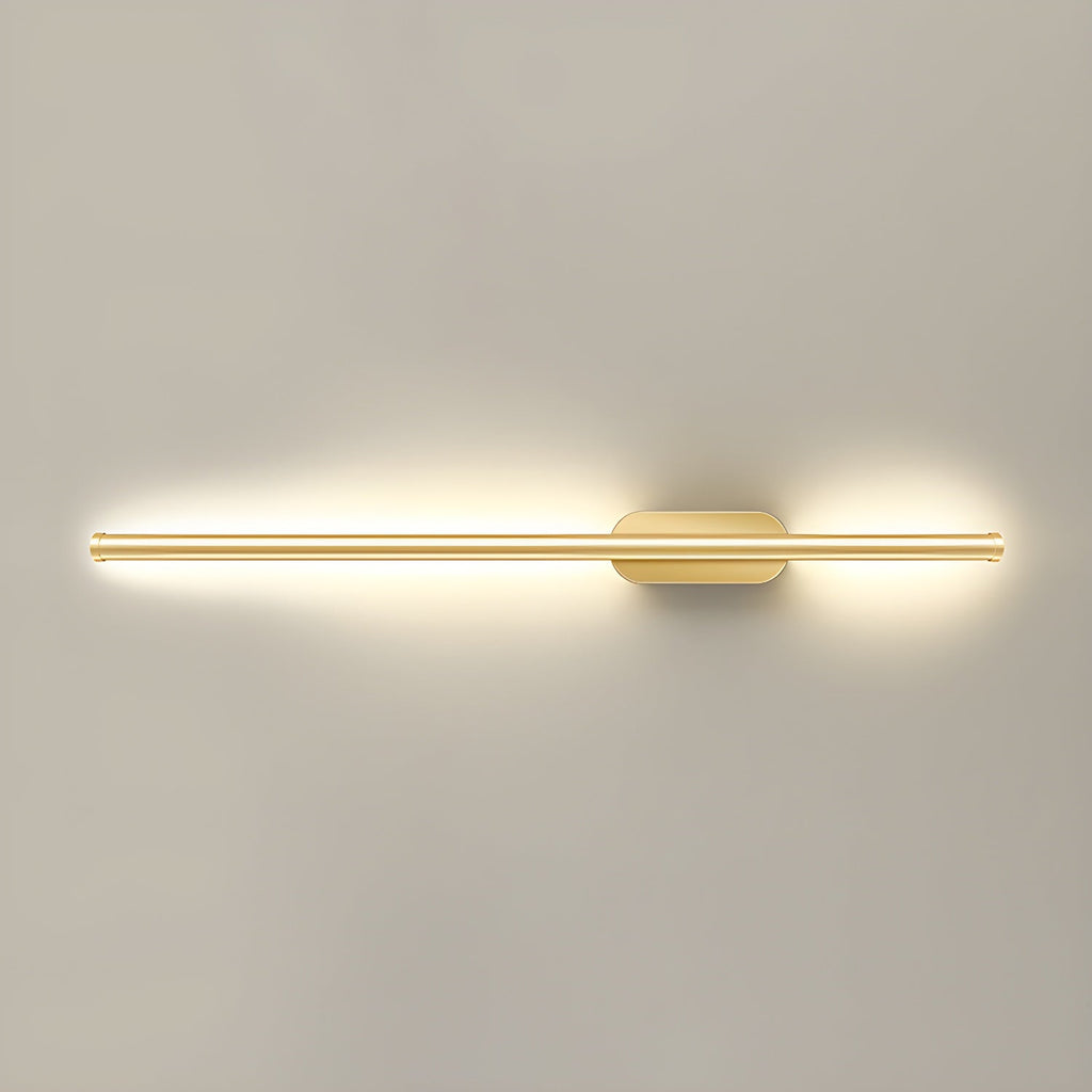 Linear wall sconce with warm glow framing a staircase wall