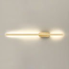 Linear wall sconce with warm glow framing a staircase wall