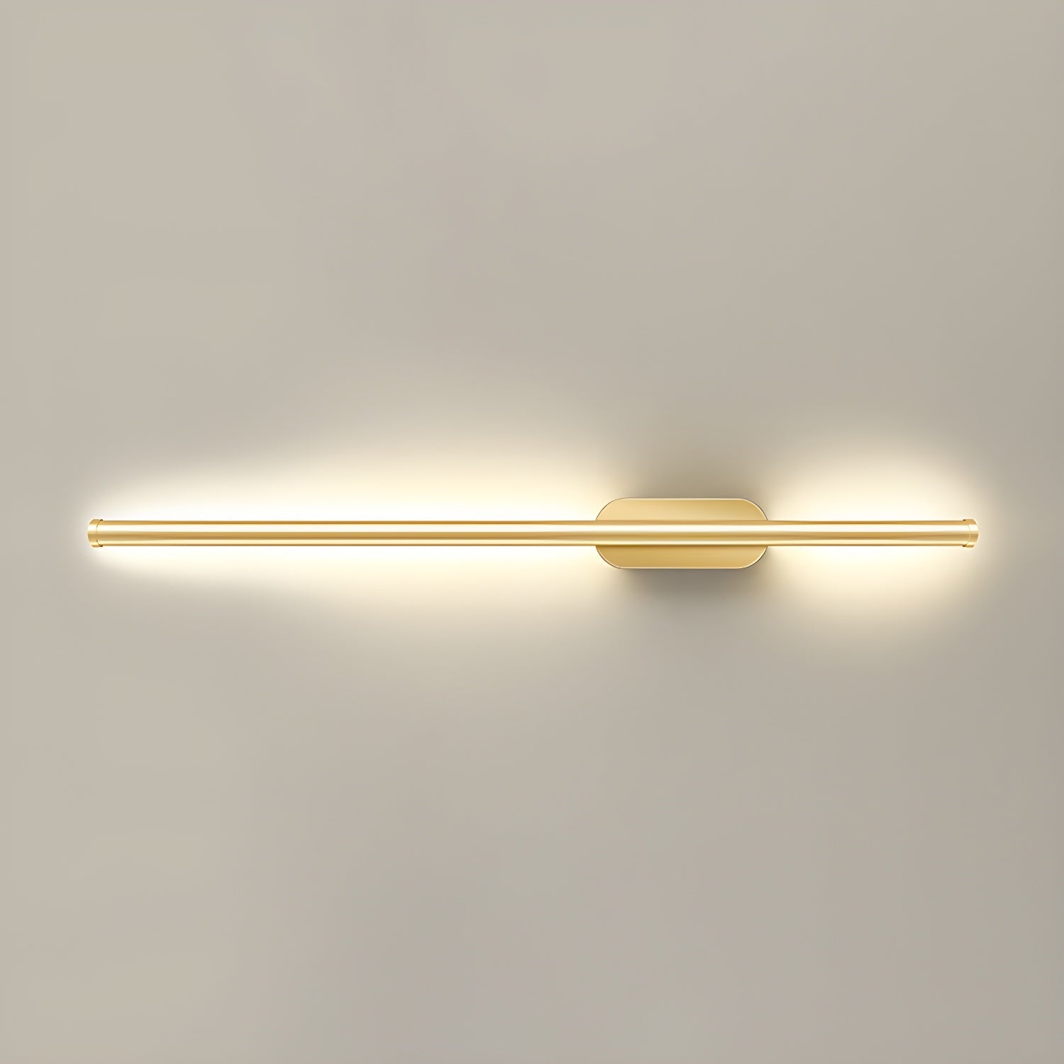 Linear wall sconce with warm glow framing a staircase wall