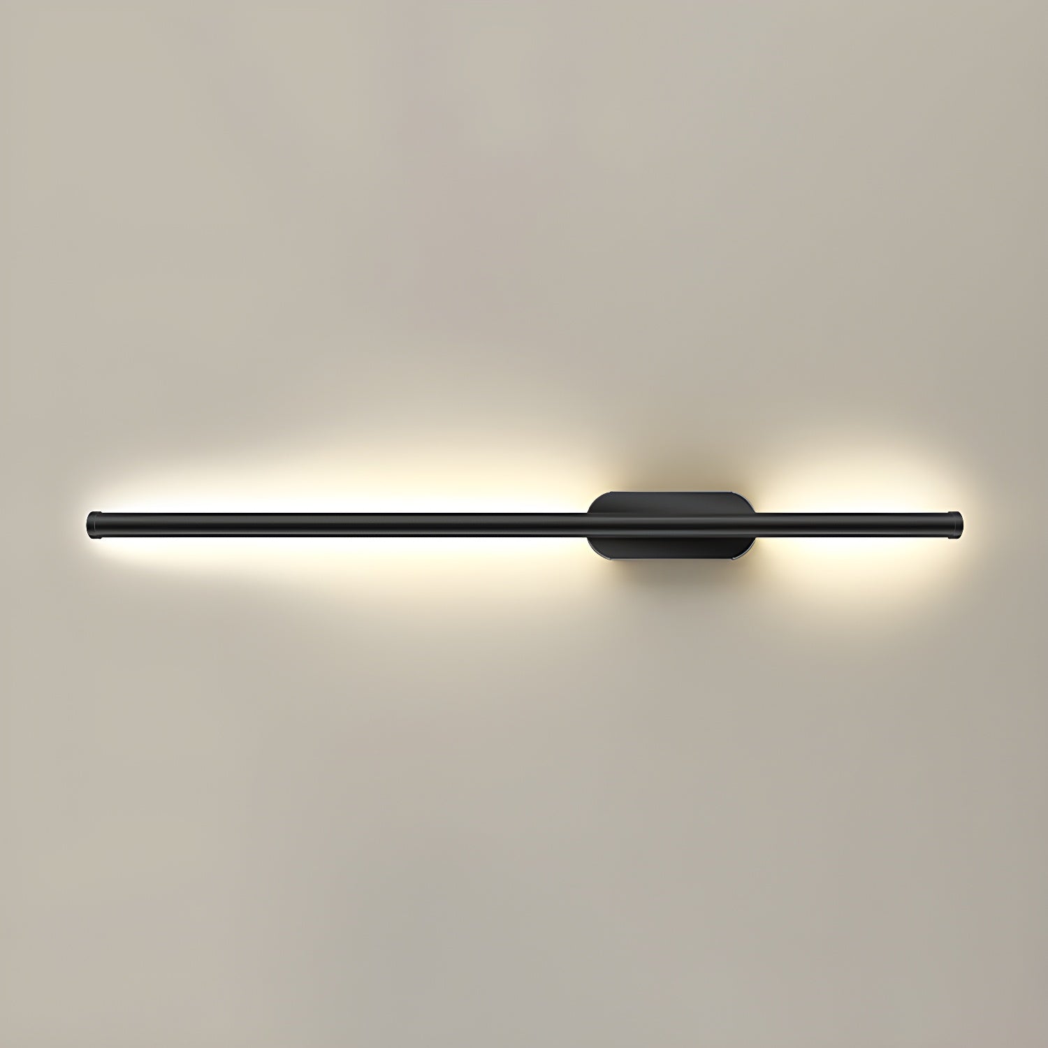 Black linear LED sconce casting soft light on a textured wall
