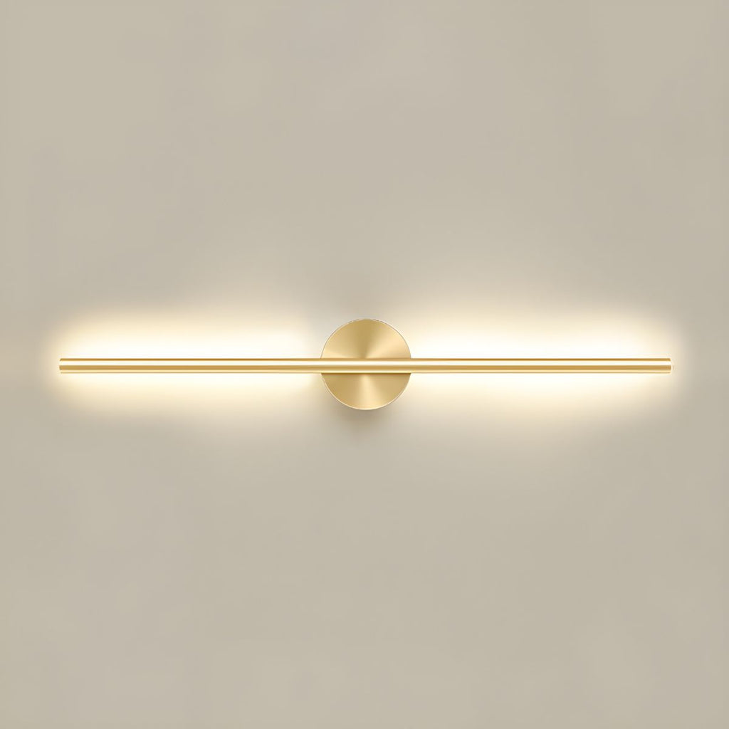 Linear wall sconce with warm LED light beside a living room sofa