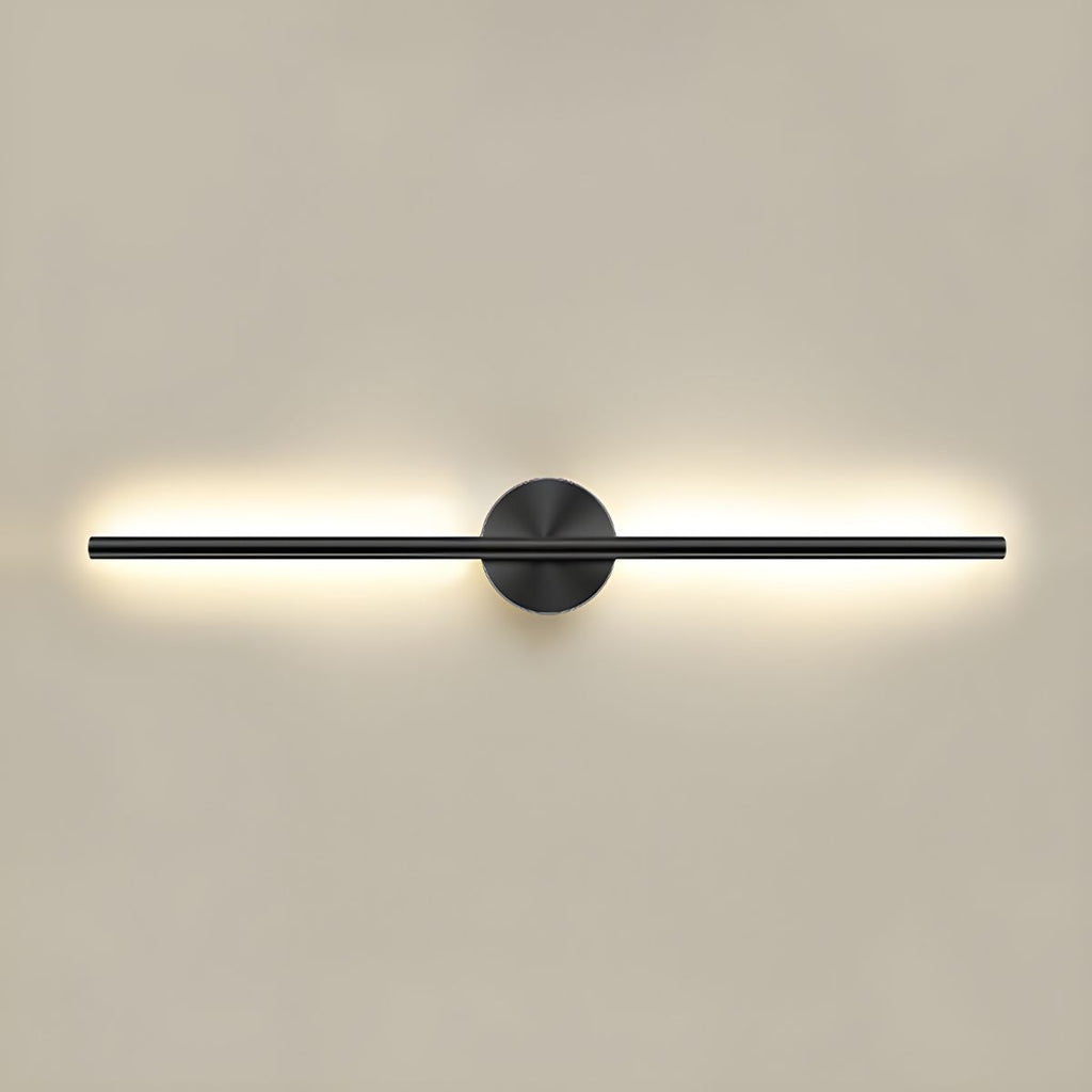 Gold dimmable linear wall sconce glowing beside framed art