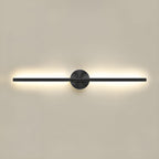 Gold dimmable linear wall sconce glowing beside framed art