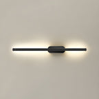 Linear LED sconce mounted vertically beside a bedroom headboard