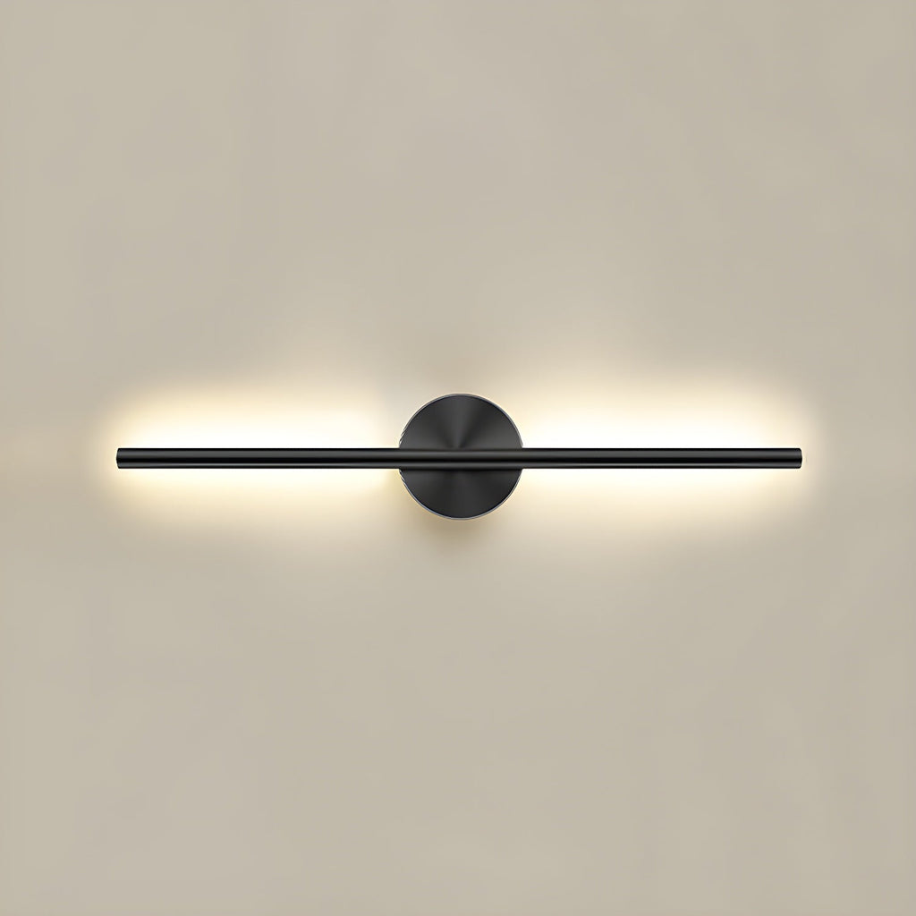 Slim linear wall sconce in gold finish glowing along a hallway