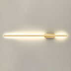 Linear wall sconce illuminating a cozy reading corner at night