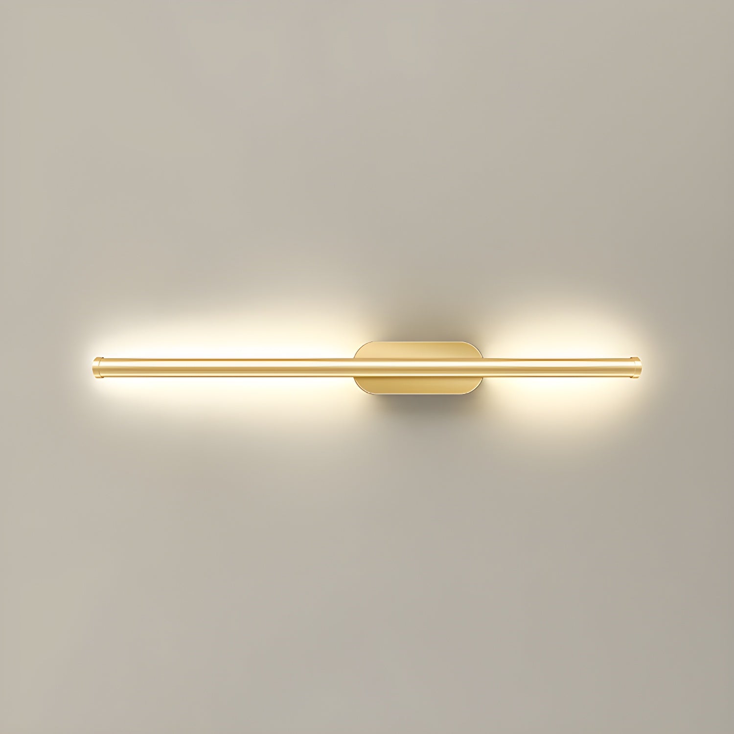 Gold linear wall sconce throwing soft warm light across plaster
