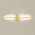 Linear LED wall sconce mounted on a wall casting soft warm light