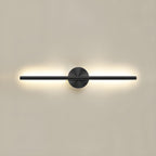 Black linear LED wall sconce illuminating a modern interior wall