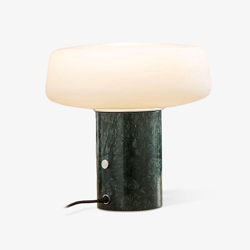 Green marble Clérachic table lamp shown alone on white, its power cord and round switch visible at the base.