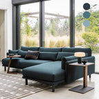 A garden is visible through the windows beyond a white marble Clérachic table lamp lit on a small side table.