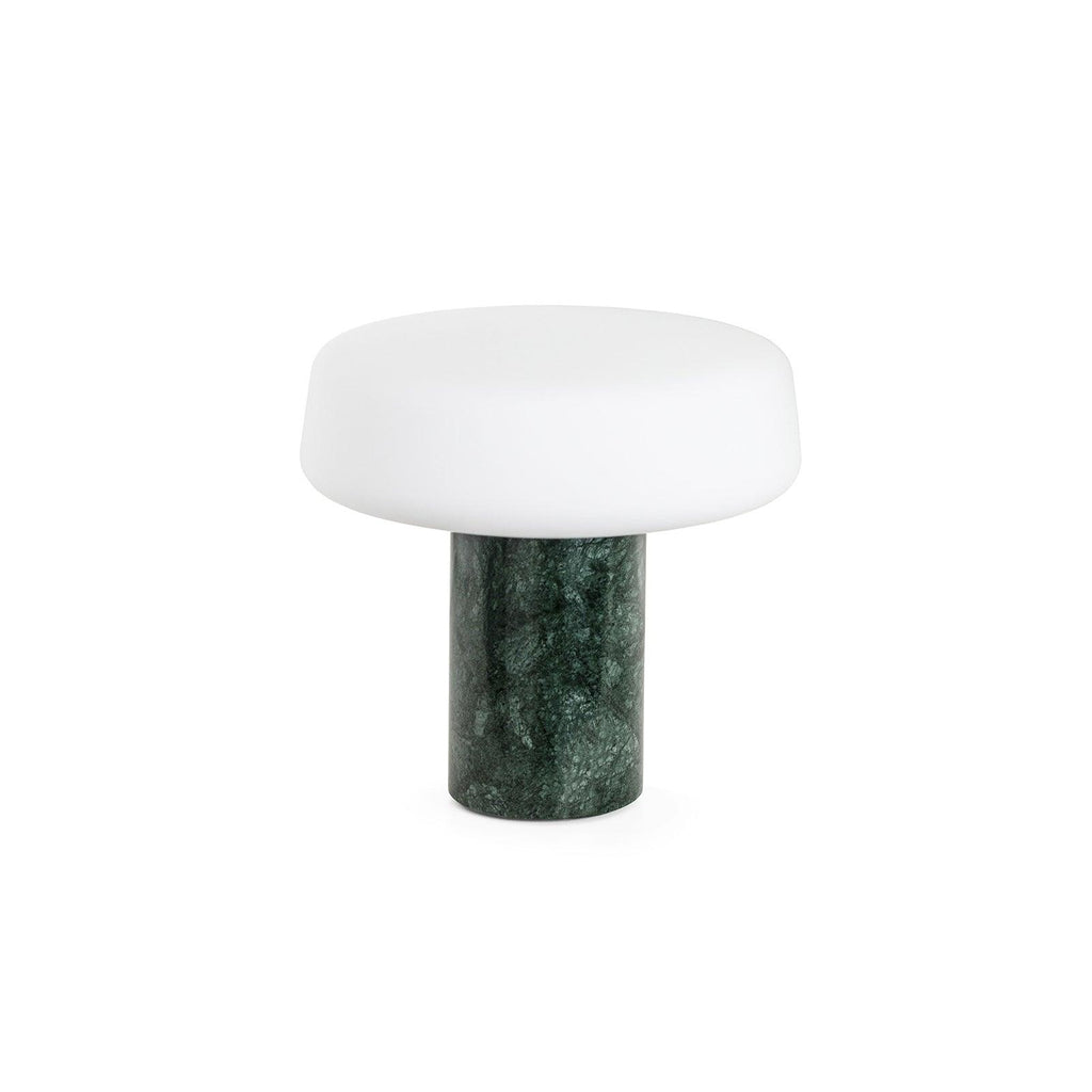 Green marble Clérachic table lamp with its frosted glass shade shown unlit against a plain white studio background.