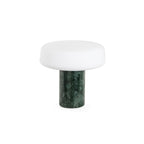Green marble Clérachic table lamp with its frosted glass shade shown unlit against a plain white studio background.